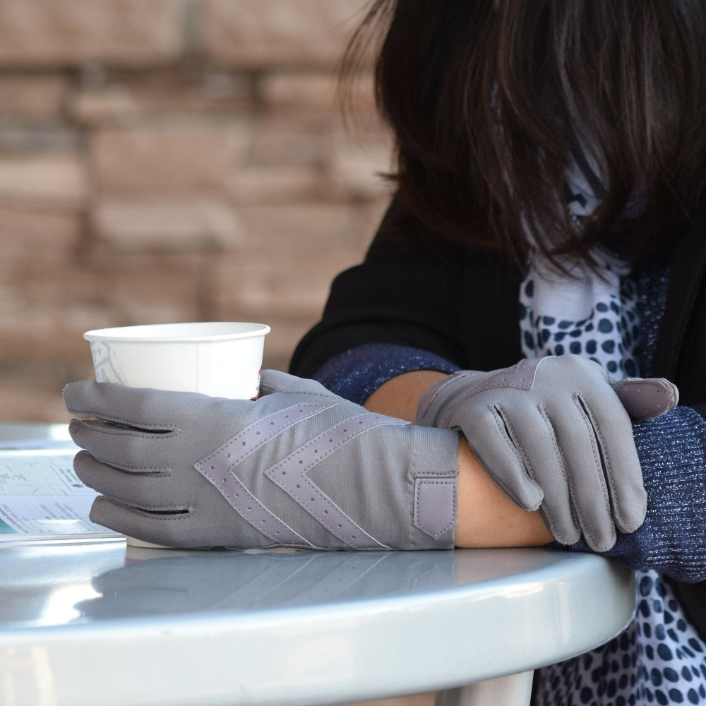 Women's Chevron Shortie Gloves in Dusty Lavender on Model sitting in a cafe holding a to-go cup #color_Dusty-Lavender