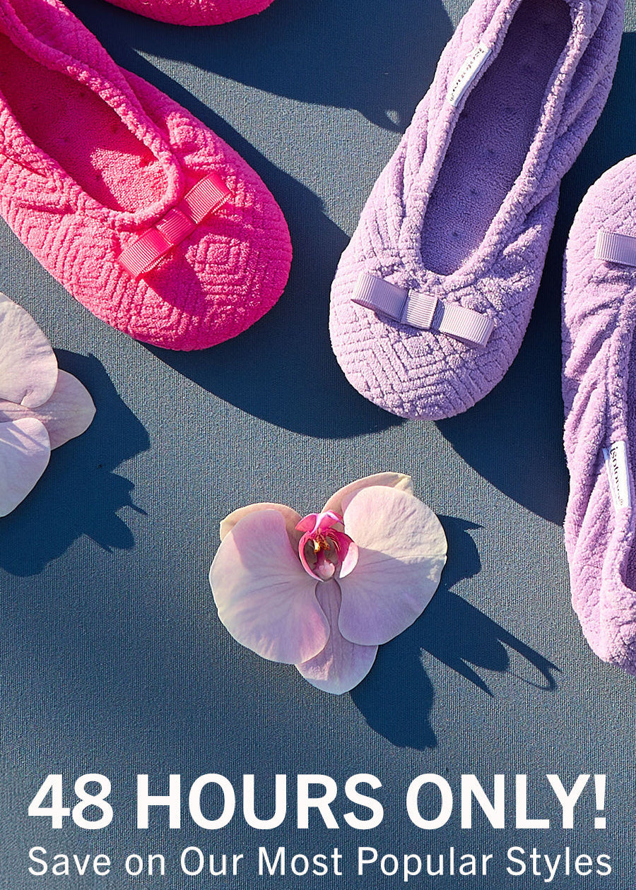 A promotional flat-lay showing several textured slip-on flats in bright pink and lavender purple, arranged on a blue surface with white flowers. Large text at the bottom reads '48 HOURS ONLY! Save on Our Most Popular Styles' with a 'Shop the Sale' button.