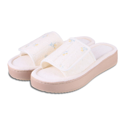 9406 Isotoner Slipper yellow Slides With floral pattern on a white background

