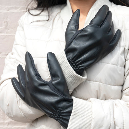 30569 A pair of black faux stretch leather gloves with smartTouch technology. 