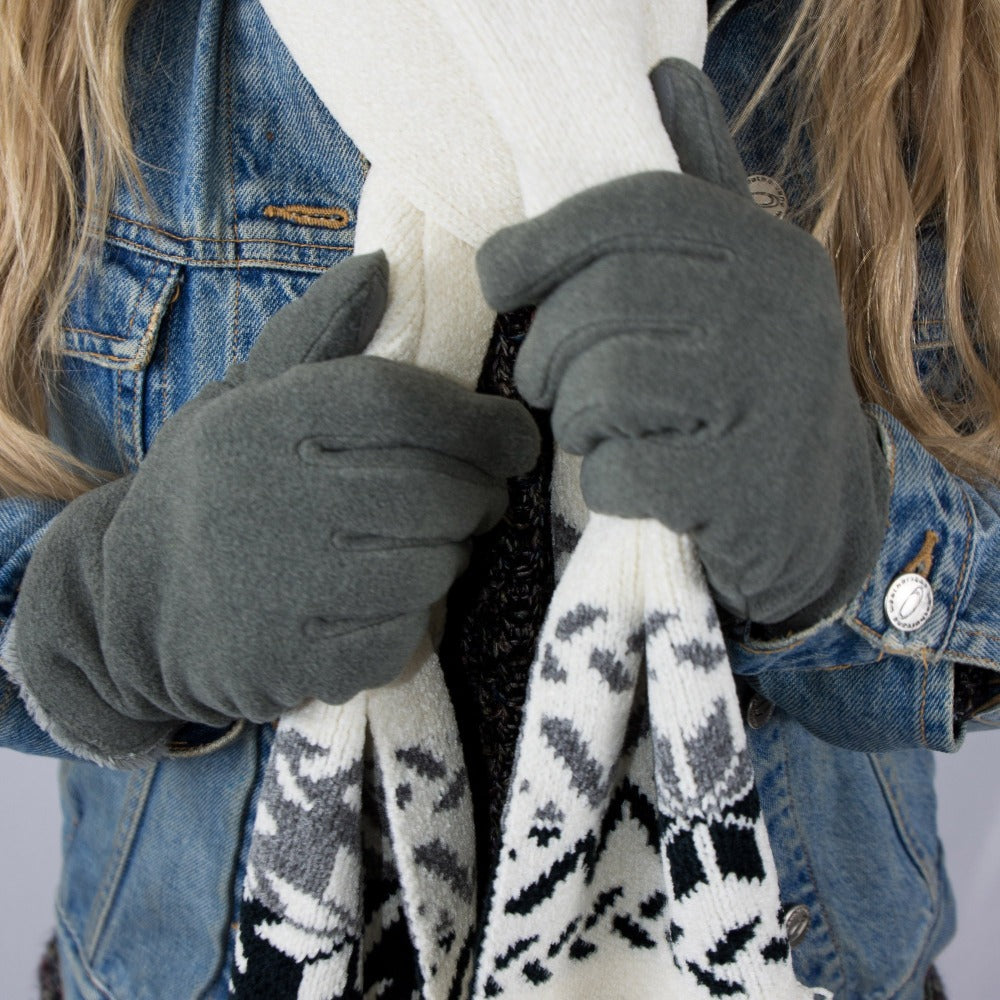 womens recycled stretch fleece glove close up on model holding scarf