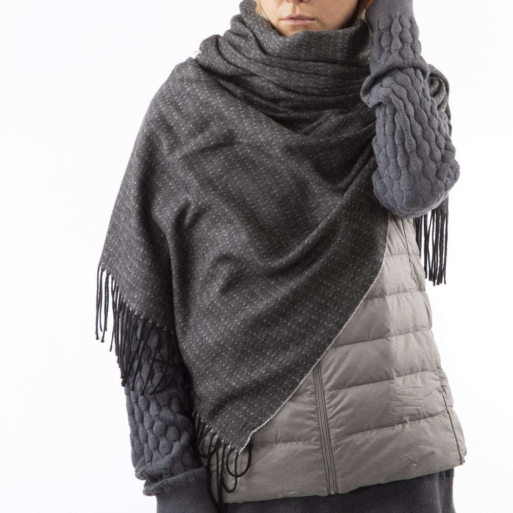 Women’s Recycled Scarf with Fringe in Black on model. Wearing as a scarf. Front View.
