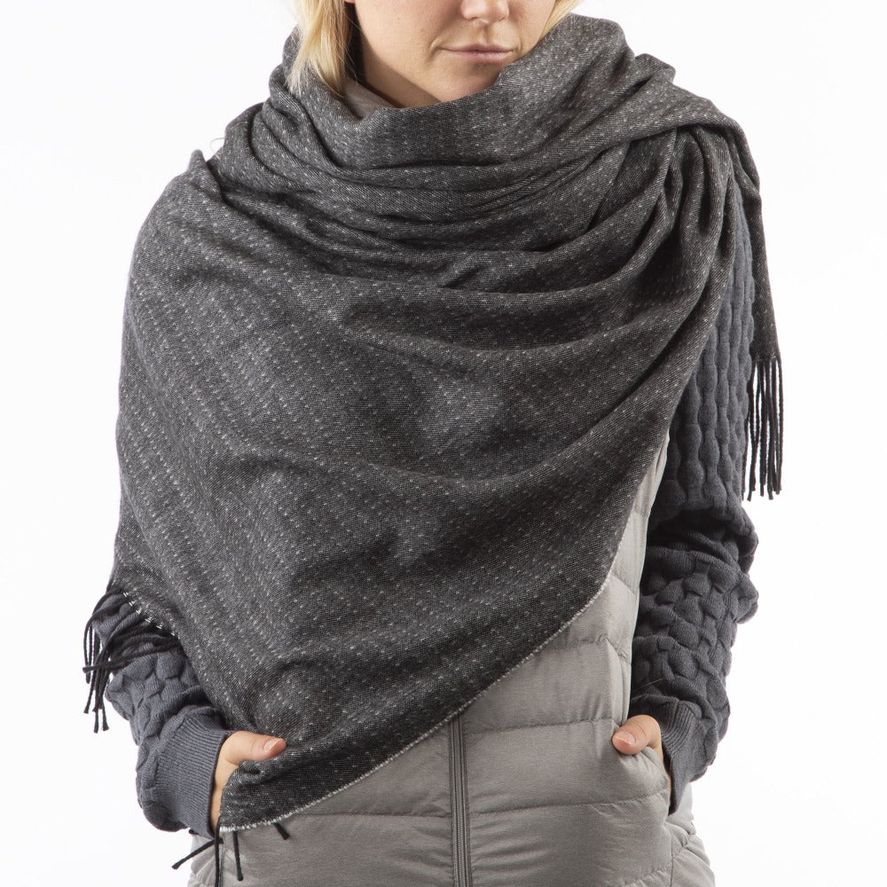 Women’s Recycled Scarf with Fringe in Black on model. Wearing as a scarf. Front View.