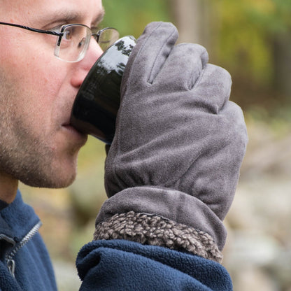 Men’s Recycled Microsuede and Berber Glove pair in Lead Grey on figure. Male model wearing gloves and sipping from a coffee mug