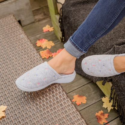 Woman wearing Embroidered Floral Terry Clog in grey color  sitting on Deck in fall 